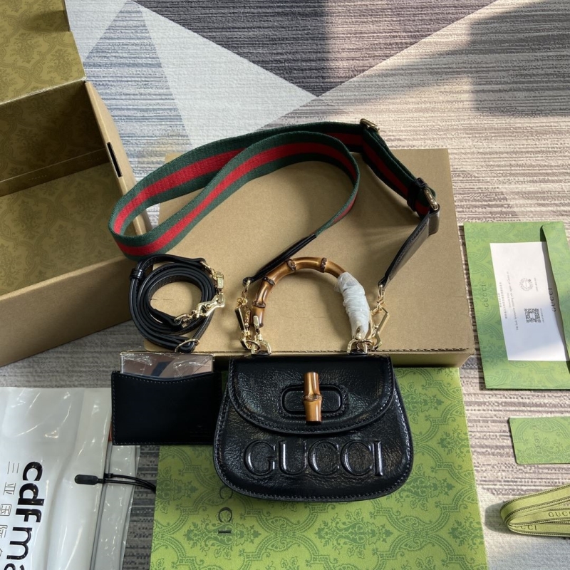 G*u*i top handle bags